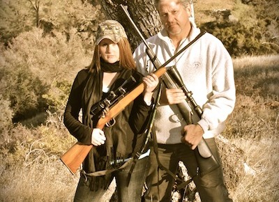 Father daughter portrait with rifles